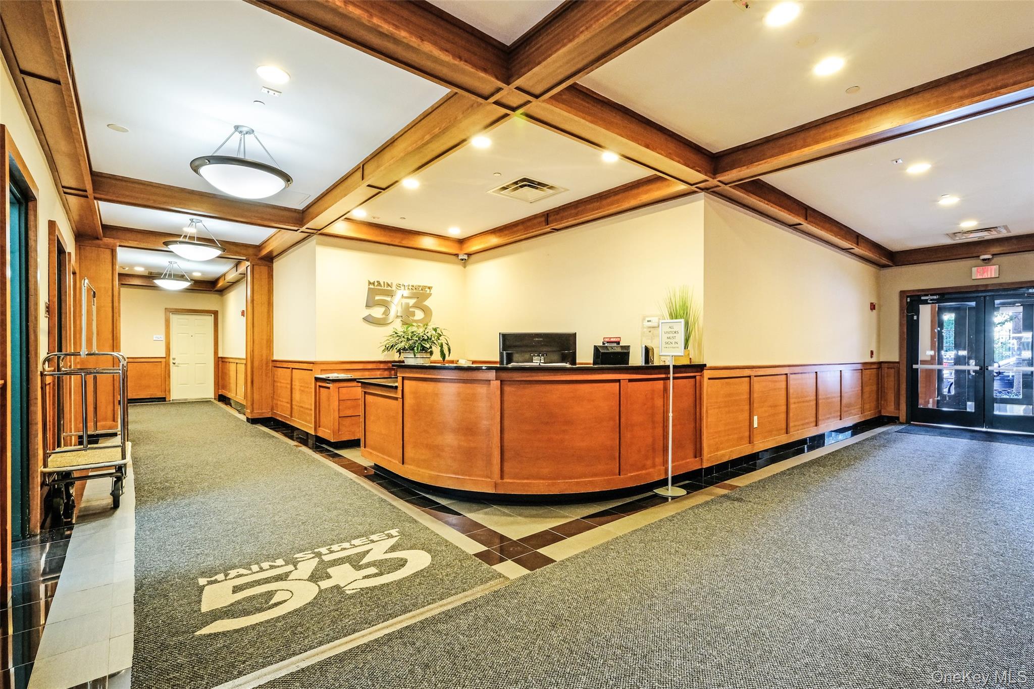 543 Main Street, Unit 402 New Rochelle, NY 10801 - Photo 2 of 21 Reception featuring wainscoting, beamed ceiling, recessed lighting, and coffered ceiling