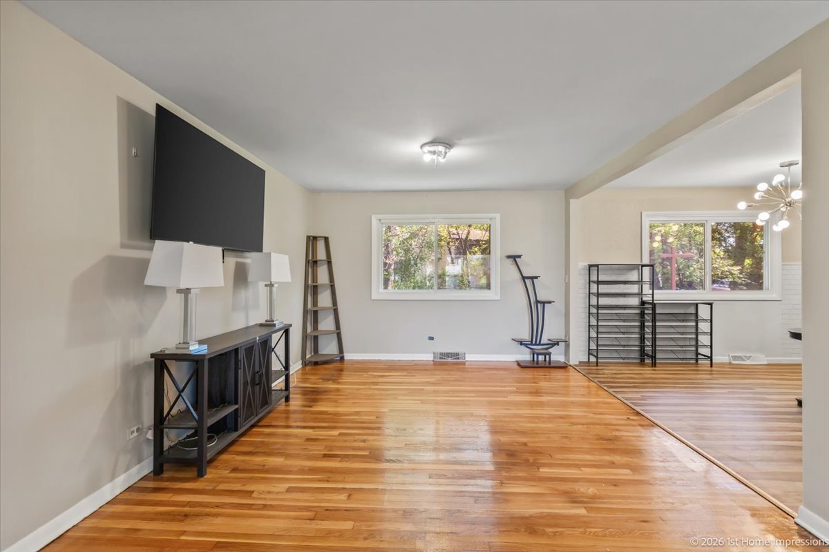 18847 May Avenue Homewood, IL 60430 - Photo 5 of 26 a view of a livingroom with wooden floor and a flat screen tv