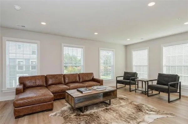 a living room with furniture and a large window