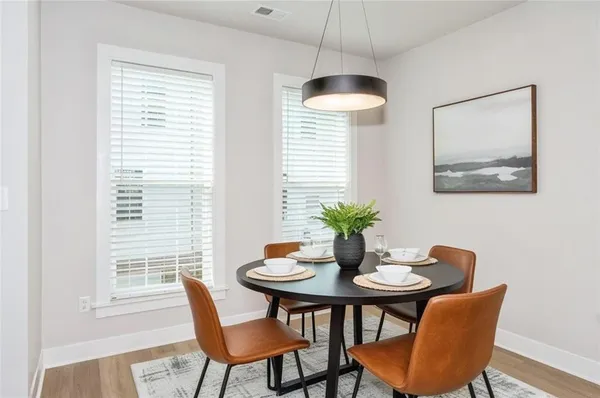 a dining room with furniture and window