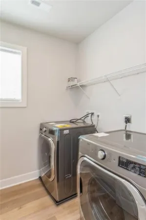 a utility room with dryer and washer