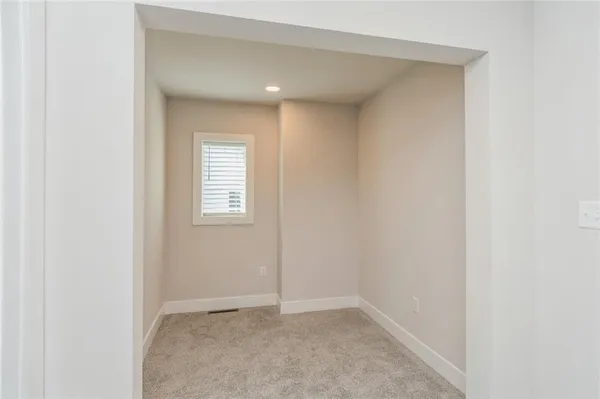 a view of an empty room and window