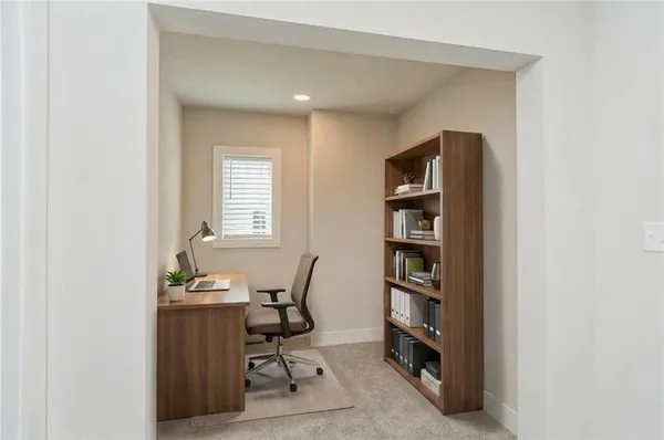 a view of a workspace with furniture