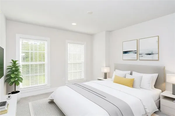 a bedroom with bed and a large window