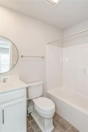 a bathroom with a sink a toilet and a bathtub