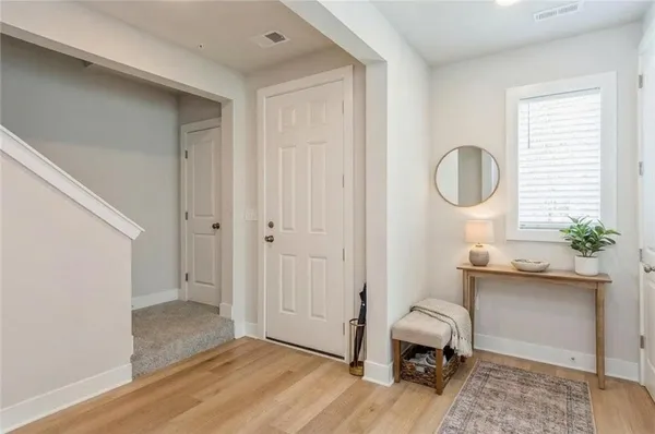 a room that has a chair and a window in it