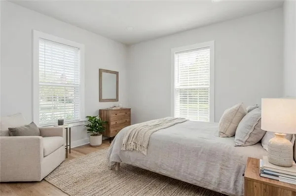 a bedroom with a bed and a couch