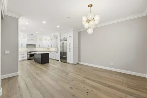 a view of kitchen with wooden floor
