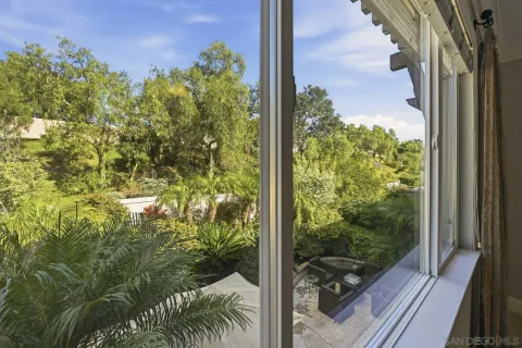 a view of a balcony with plants