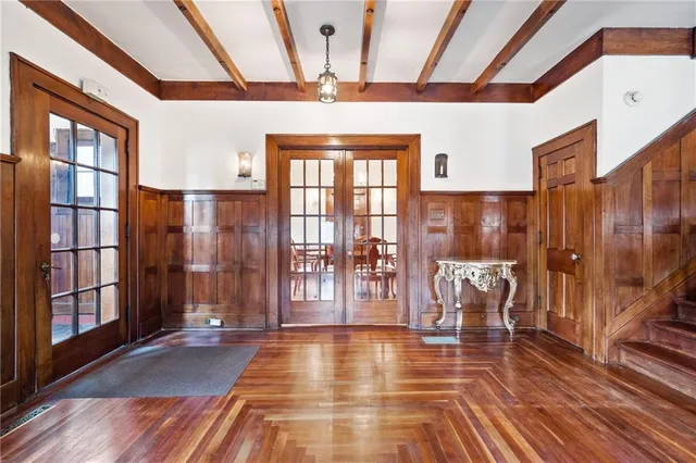 a view of a furniture room with furniture wooden floor and a chandelier