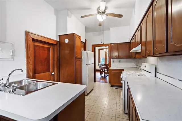 a kitchen with a refrigerator a sink and dishwasher