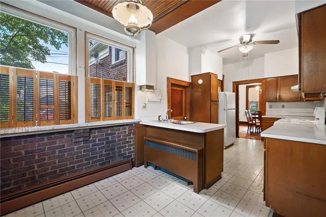 a kitchen with stainless steel appliances granite countertop a stove a sink and dishwasher