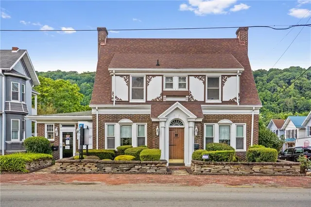 a front view of a house with a yard