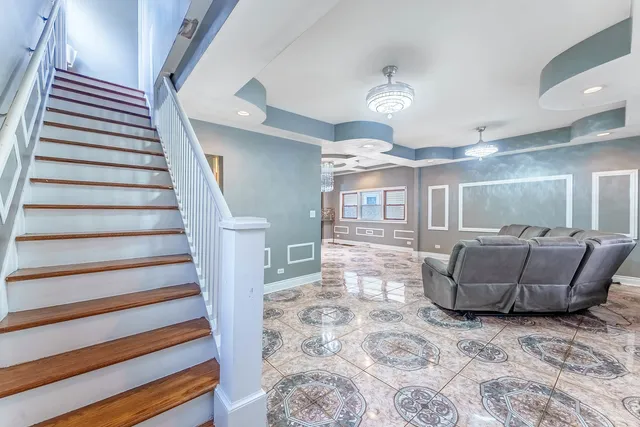 a room with furniture and stairs