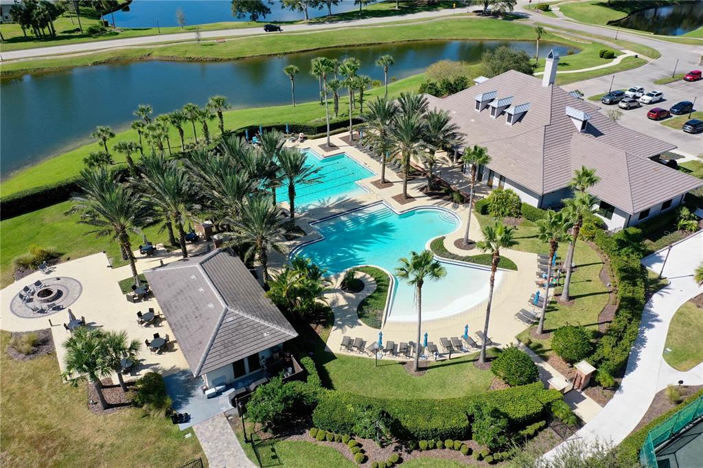426 Long Cove Road Ormond Beach, FL 32174 - Photo 37 of 73 an aerial view of a house with a garden and lake view