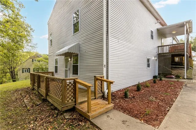 a view of a wooden deck with furniture