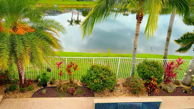 a view of swimming pool with seating area