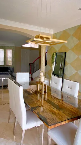 a spacious bathroom with a granite countertop tub mirror and double vanity