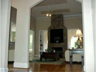 Other. 953 Rivers Edge Drive; Arched openings lead into Great Room with grand stone Fireplace and beautiful hardwood floors.