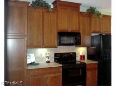 Other. 953 Rivers Edge Drive; Kitchen with cherry cabinetry with rope inlay. Solid surface countertops. All appliances included!