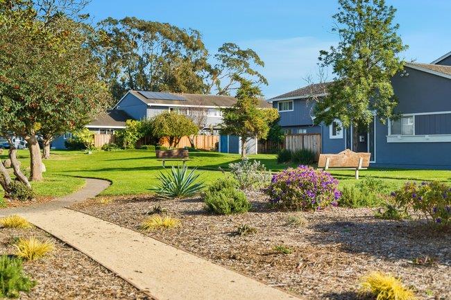 1031 Colonel Way Half Moon Bay, CA 94019 - Photo 37 of 52 a front view of a house with a yard and potted plants