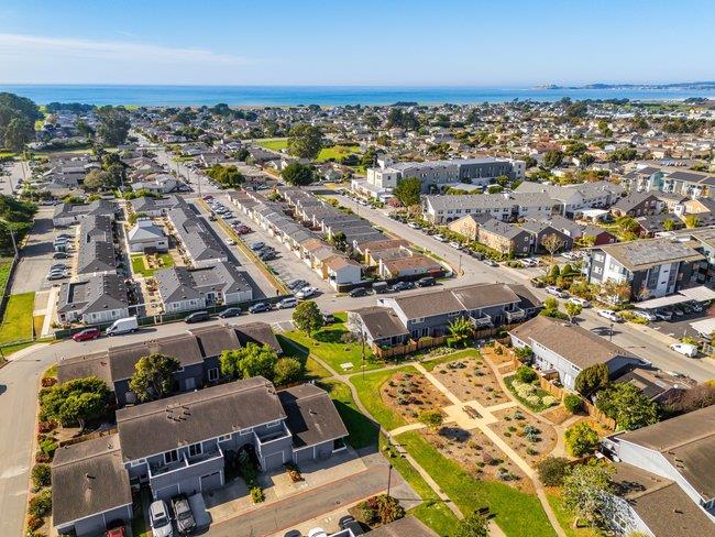 1031 Colonel Way Half Moon Bay, CA 94019 - Photo 44 of 52 an aerial view of a city with lots of residential buildings and ocean view in back