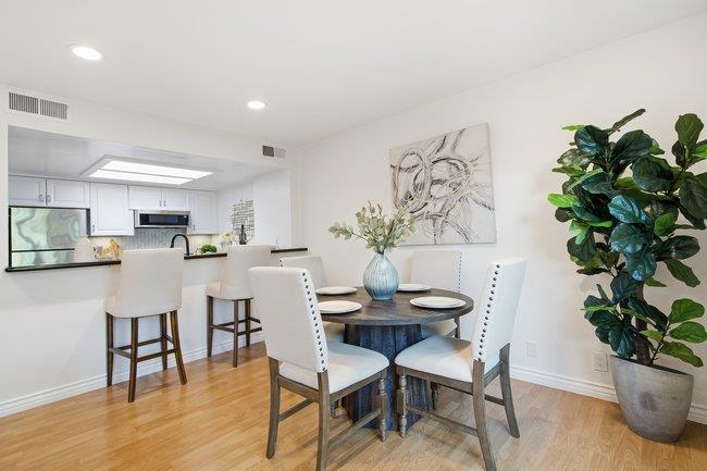 1031 Colonel Way Half Moon Bay, CA 94019 - Photo 10 of 52 a view of a dining room with furniture and wooden floor