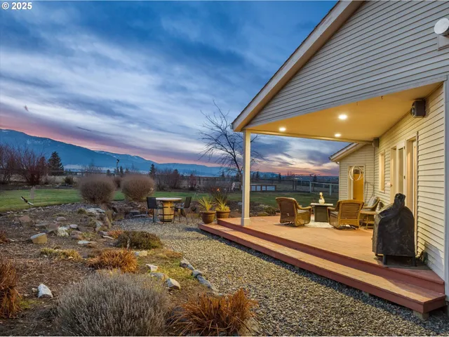 an aerial view of a house with a ocean view