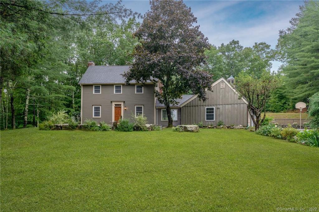 232 Clapboard Road Bridgewater, CT 06752 - Photo 1 of 1 a front view of a house with a yard and trees