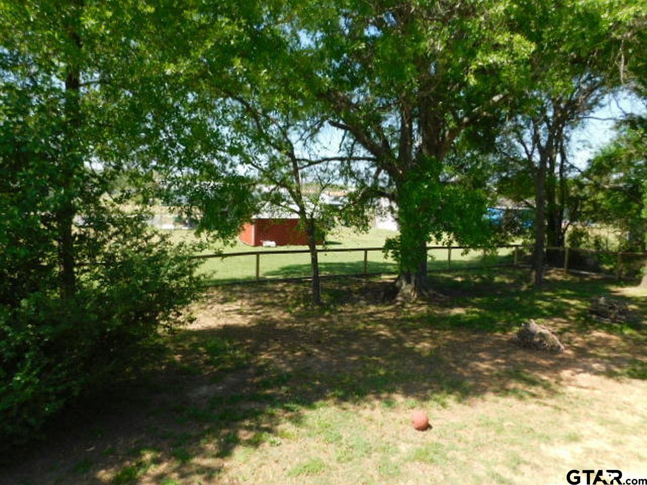 285 Caddo Quitman, TX 75783 - Photo 3 of 14 a view of a park that has large trees