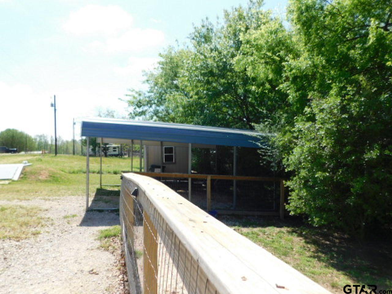 285 Caddo Quitman, TX 75783 - Photo 6 of 14 a view of house with backyard space and balcony