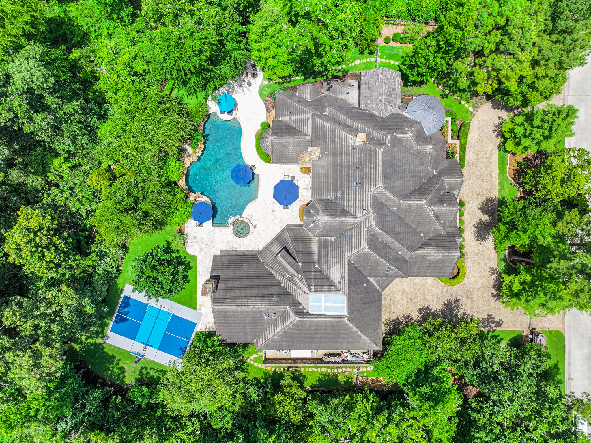 247 South Fazio Way Spring, TX 77389 - Photo 4 of 17 247 S. Fazio Way offers a true resort-style living experience with a sparkling pool, sports court, expansive outdoor living spaces, and unmatched privacy in the heart of Carlton Woods.