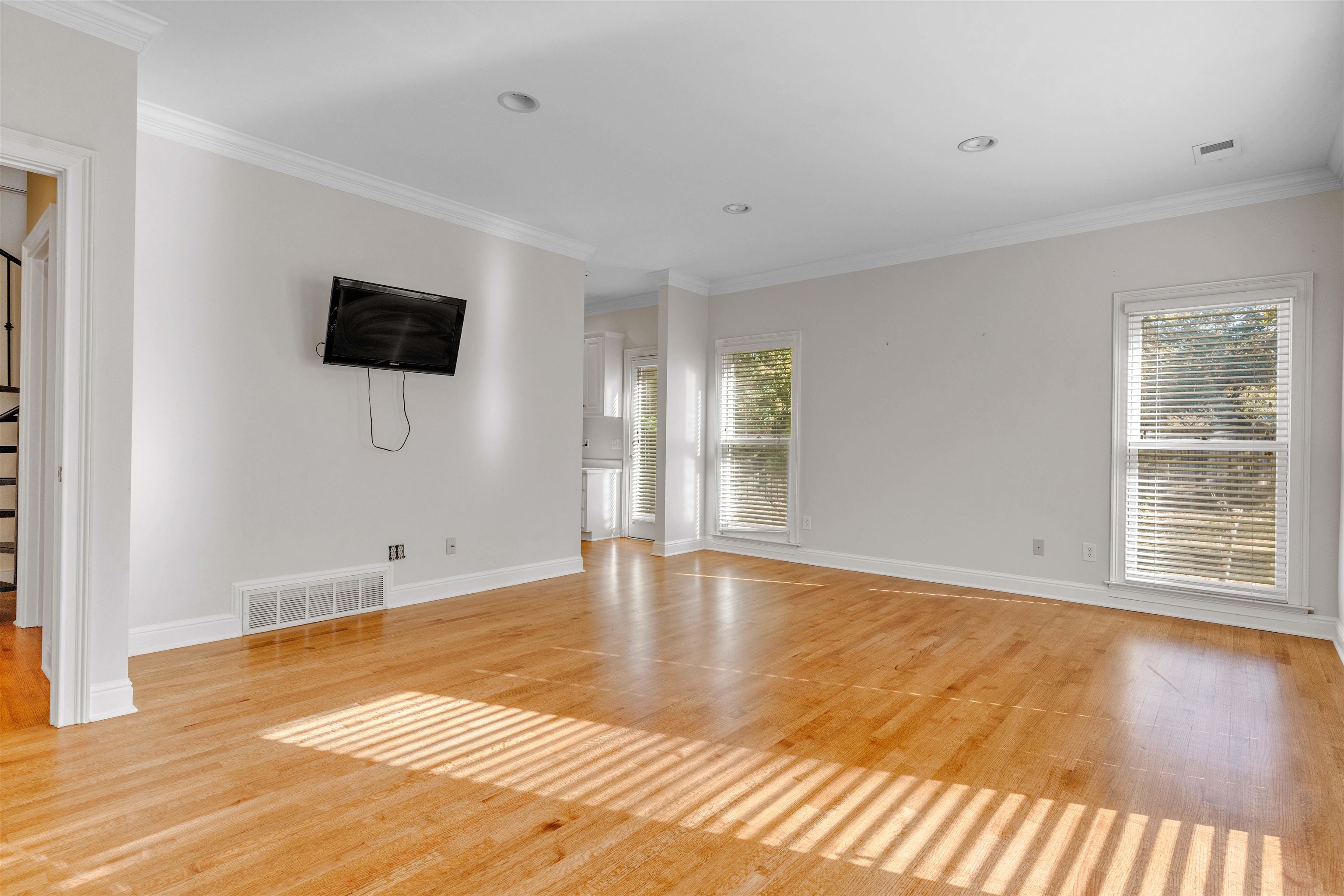2014 Heather Cove Memphis, TN 38119 - Photo 15 of 40 Unfurnished living room featuring ornamental molding, light wood-style flooring, and recessed lighting