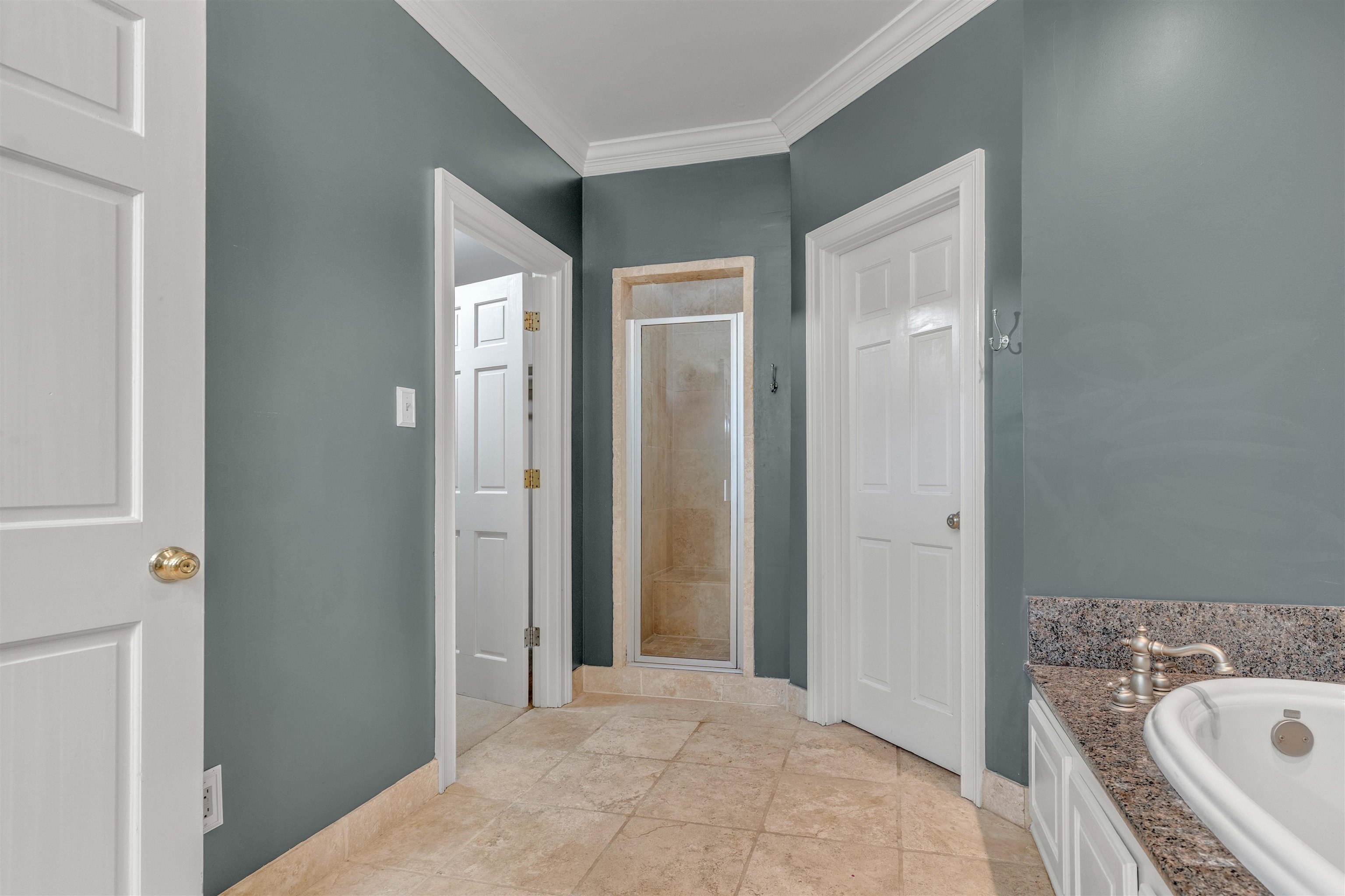 2014 Heather Cove Memphis, TN 38119 - Photo 21 of 40 Full bath with a stall shower, crown molding, a bath, and light tile patterned floors