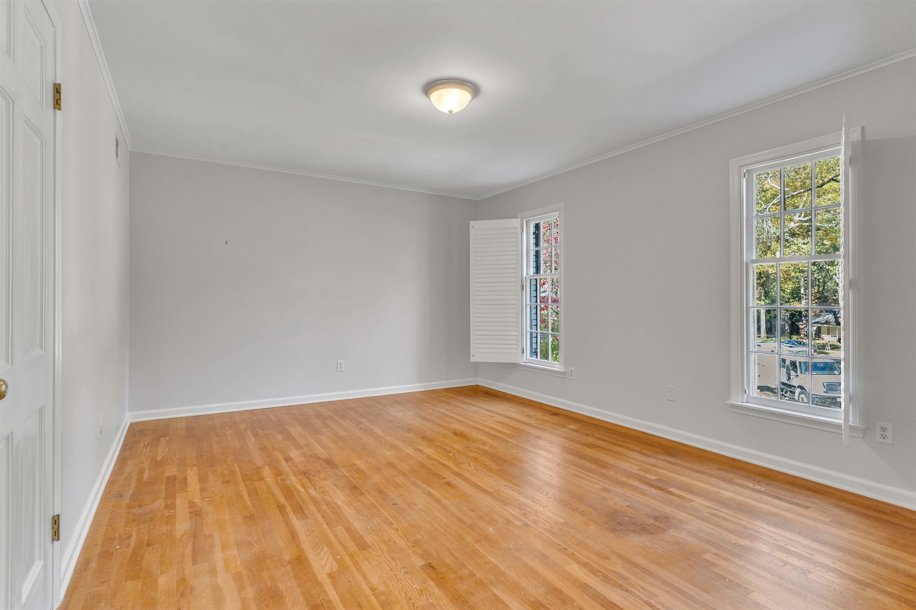 2014 Heather Cove Memphis, TN 38119 - Photo 28 of 40 a view of an empty room with wooden floor and a window
