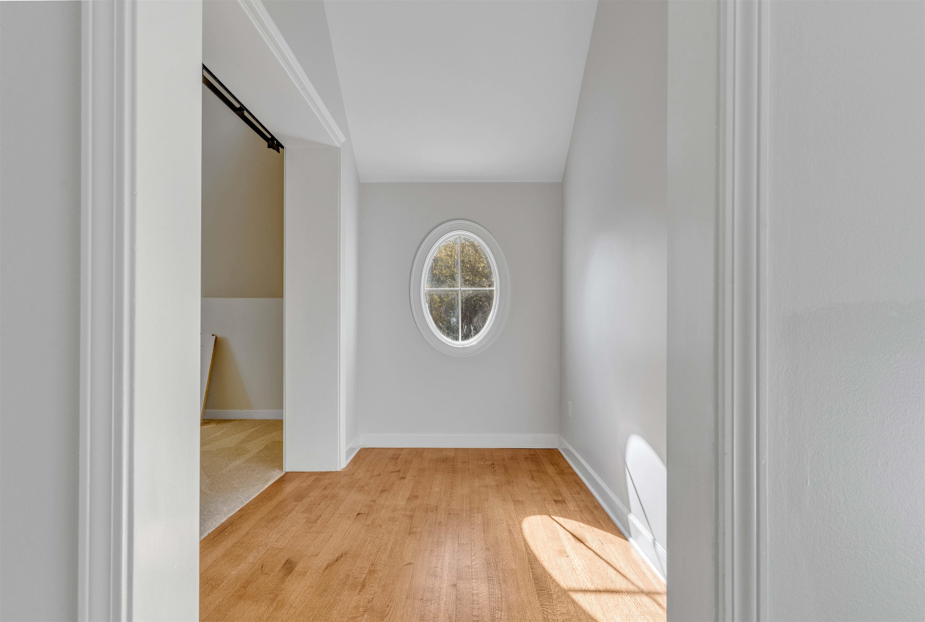 2014 Heather Cove Memphis, TN 38119 - Photo 33 of 40 Unfurnished room with light wood-style floors and baseboards