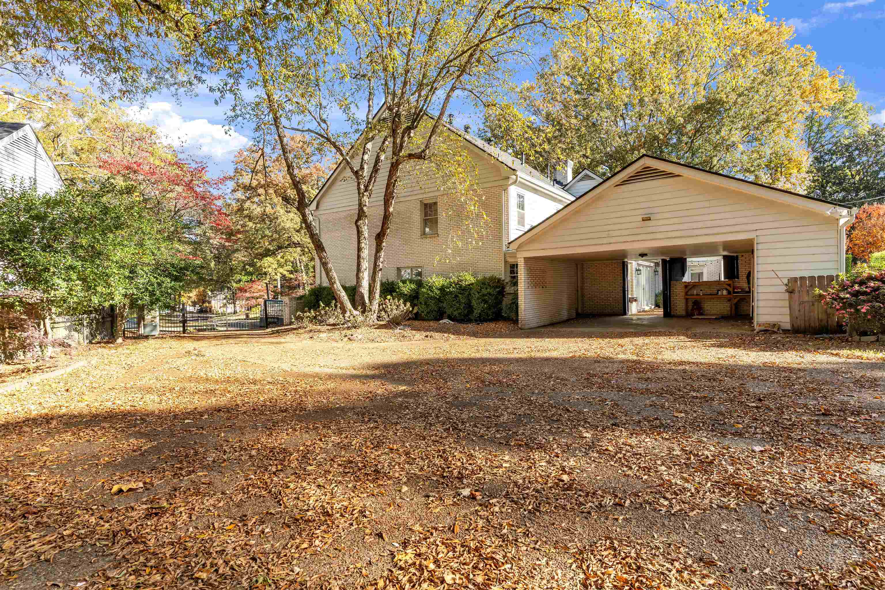 2014 Heather Cove Memphis, TN 38119 - Photo 38 of 40 View of front of home featuring brick siding, a patio area, and a carport
