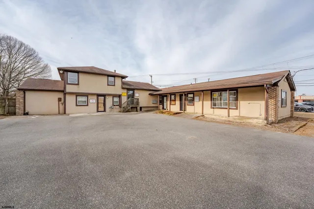 a view of a house with large windows