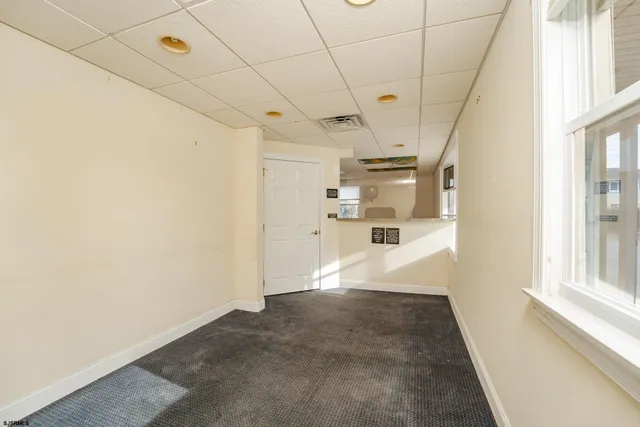 a bathroom with a sink toilet and a mirror