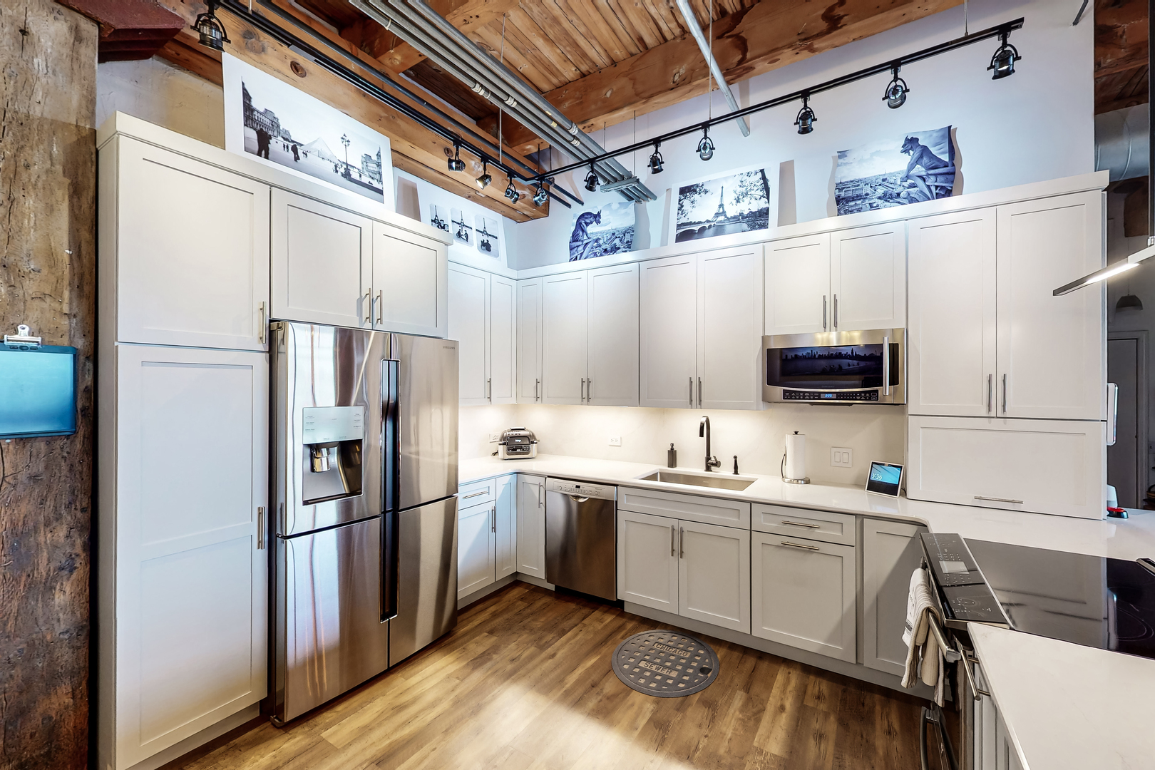 312 North May Street, Unit 3F Chicago, IL 60607 - Photo 2 of 22 a kitchen with a sink stainless steel appliances and cabinets