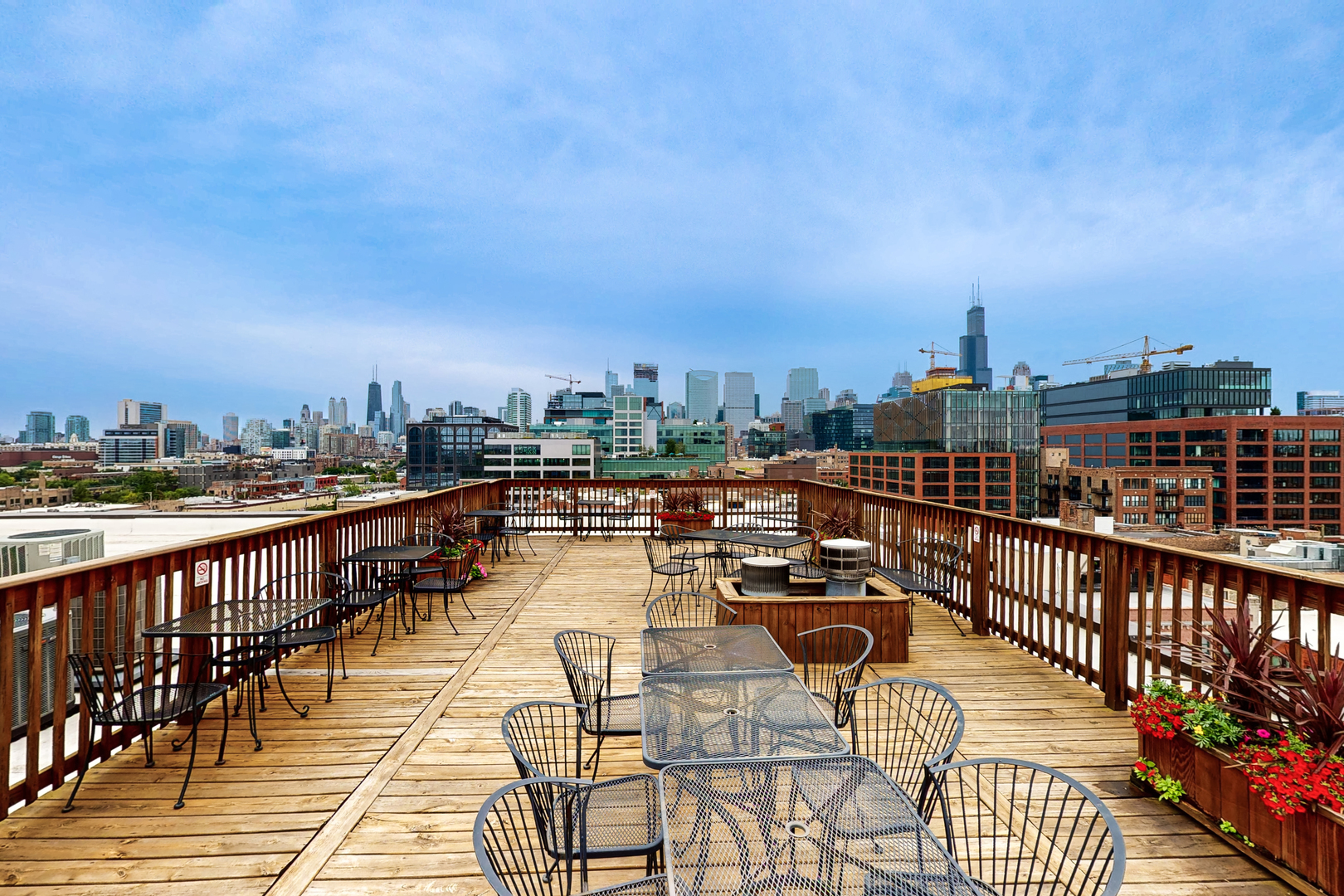 312 North May Street, Unit 3F Chicago, IL 60607 - Photo 21 of 22 a view of a balcony with wooden benches