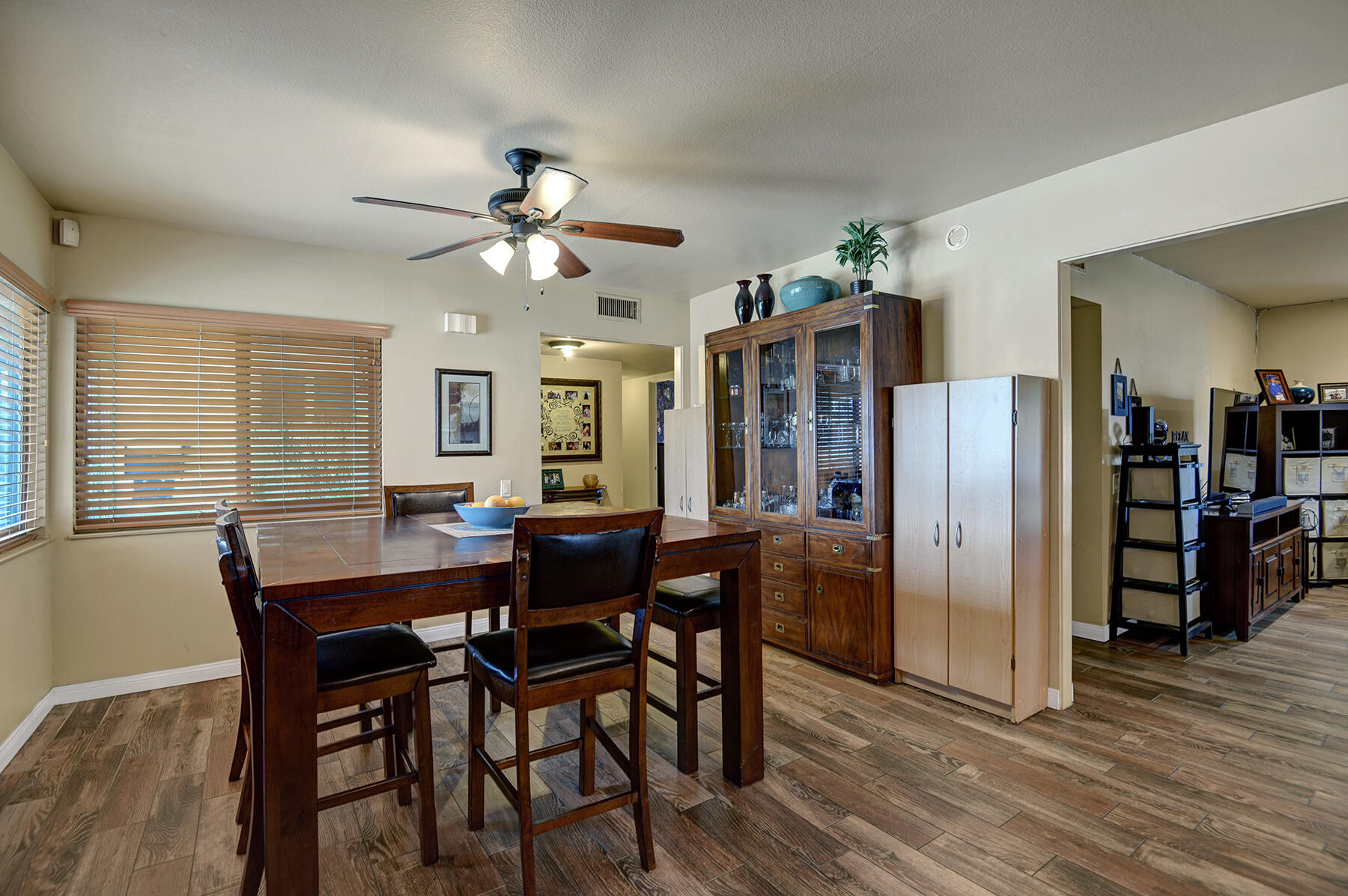 44952 Windsor Drive Indio, CA 92201 - Photo 11 of 24 a view of a dining room with furniture and wooden floor