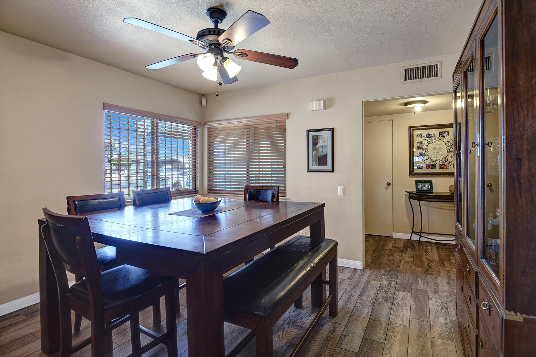 44952 Windsor Drive Indio, CA 92201 - Photo 12 of 24 a view of a dining room with furniture window and wooden floor