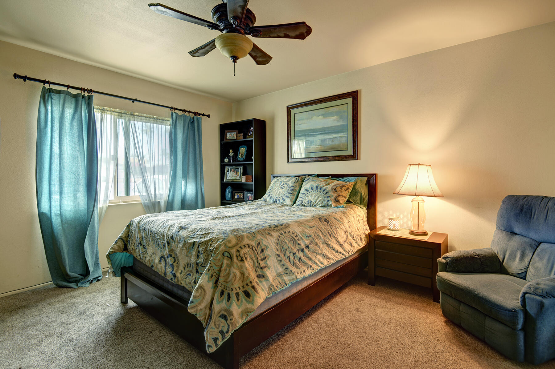 44952 Windsor Drive Indio, CA 92201 - Photo 14 of 24 a bedroom with a bed and window