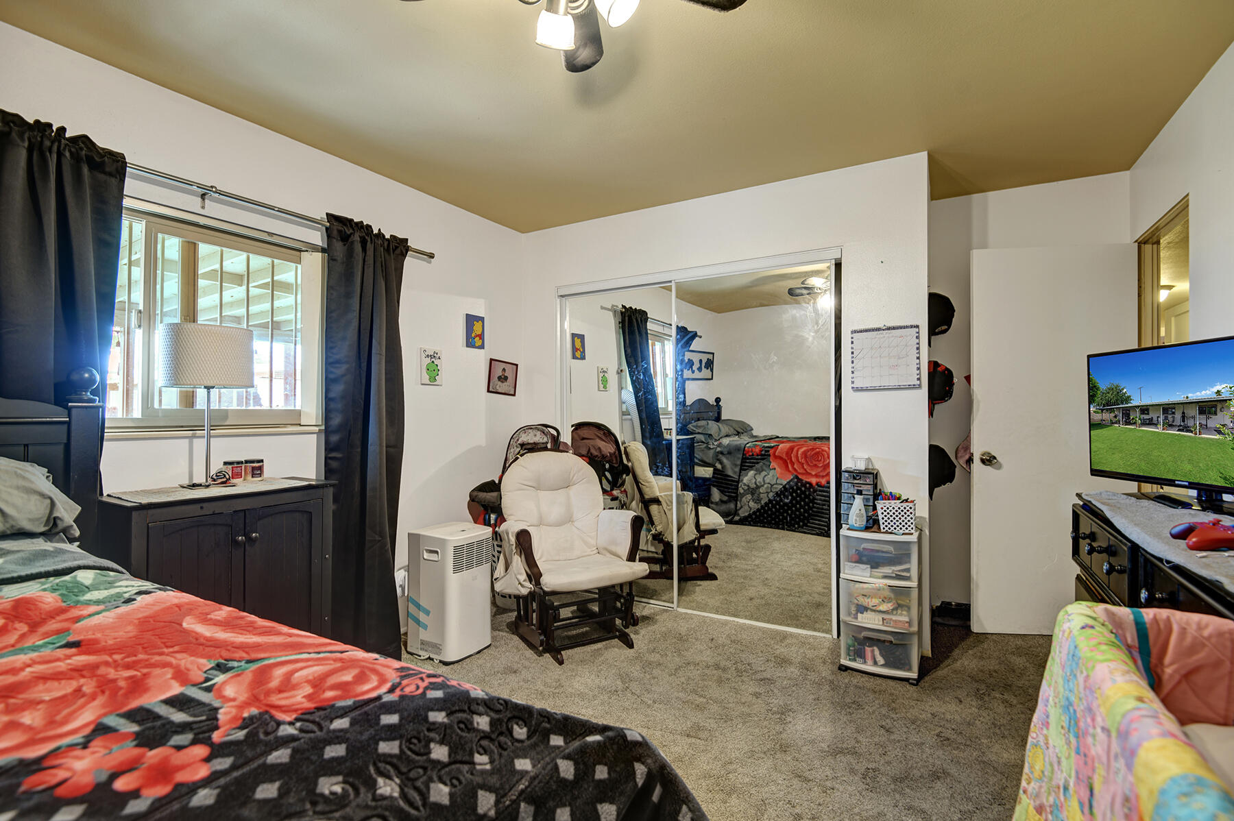 44952 Windsor Drive Indio, CA 92201 - Photo 18 of 24 a bedroom with bed and a window