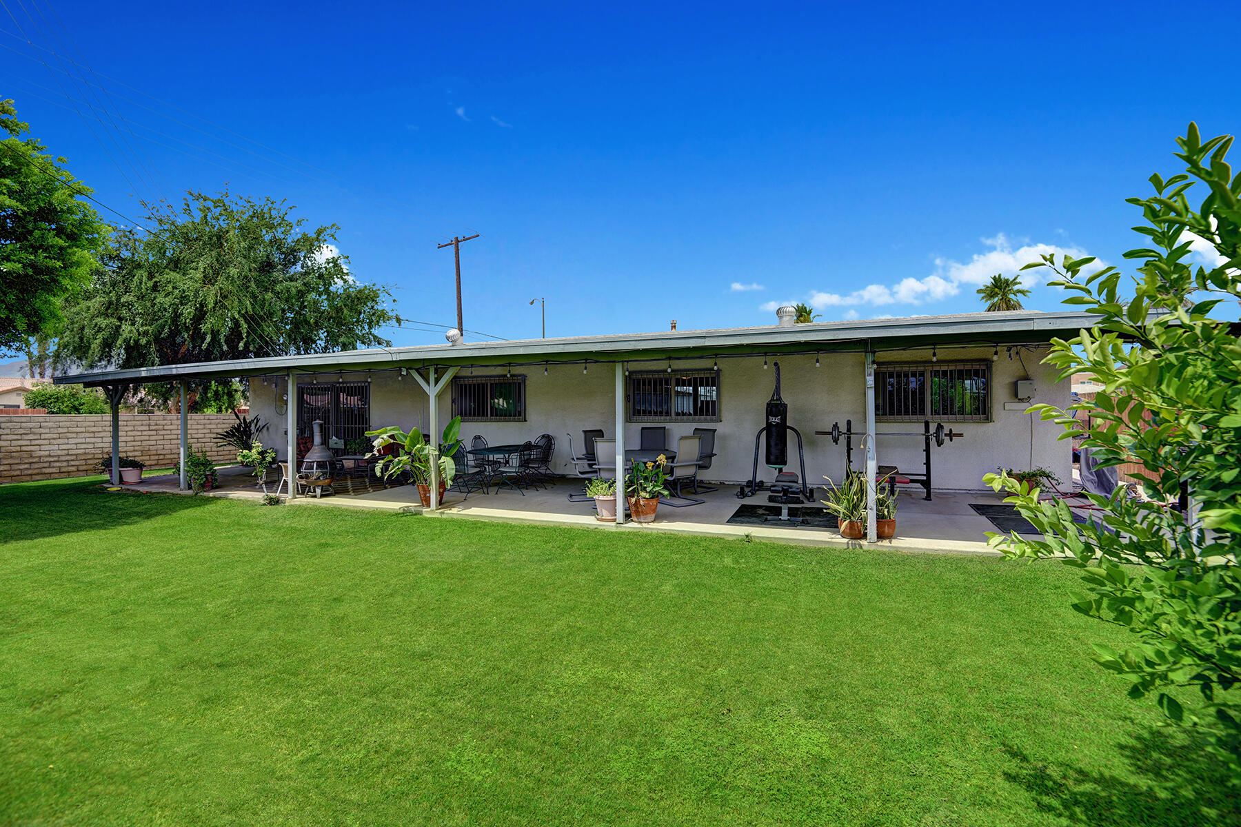 44952 Windsor Drive Indio, CA 92201 - Photo 22 of 24 a view of a house with backyard porch and sitting area