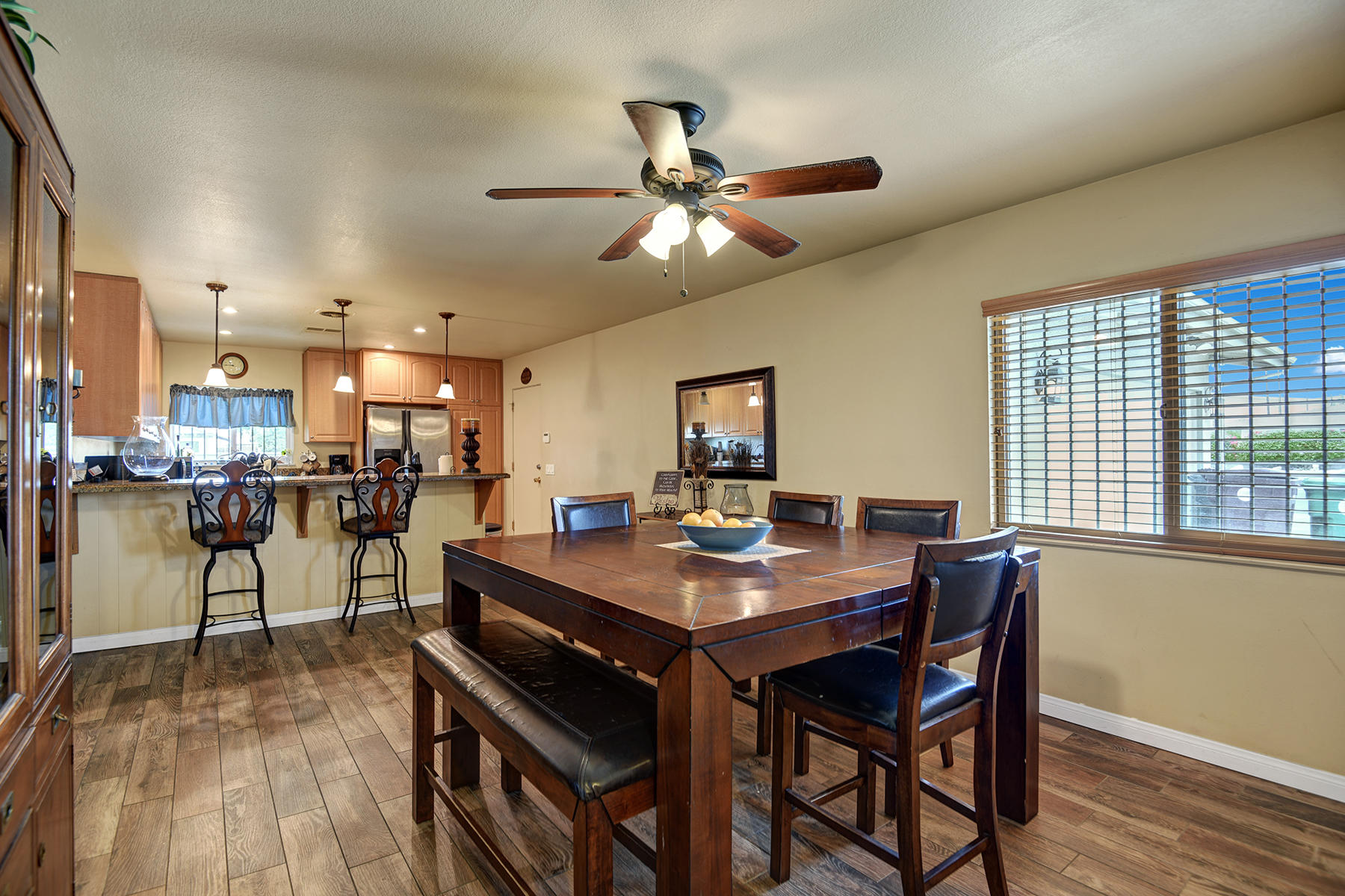 44952 Windsor Drive Indio, CA 92201 - Photo 5 of 24 a view of a dining room with furniture and wooden floor