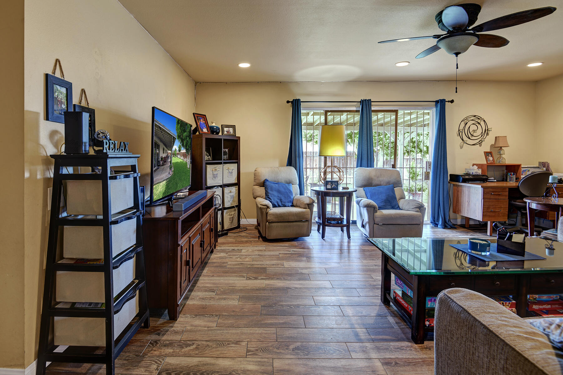 44952 Windsor Drive Indio, CA 92201 - Photo 10 of 24 a living room with furniture a window and a flat screen tv