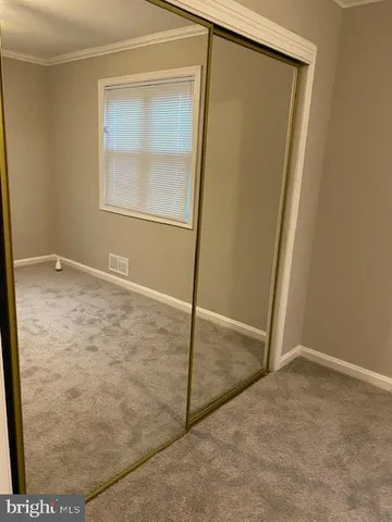 a bathroom with a granite countertop toilet and a shower