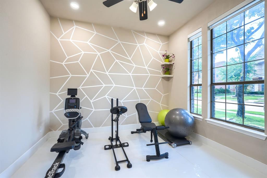 2246 Longview Road Irving, TX 75063 - Photo 4 of 40 Dedicated room featuring large windows, recessed lighting, and a ceiling fan